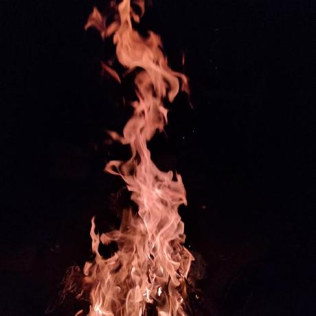 A campfire burning at night
